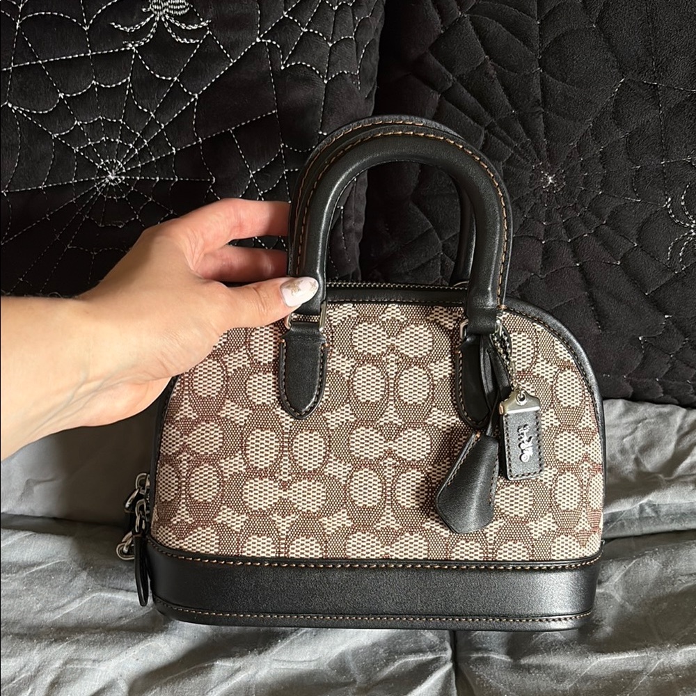 Coach Black and Brown Signature Revel 24 Handbag